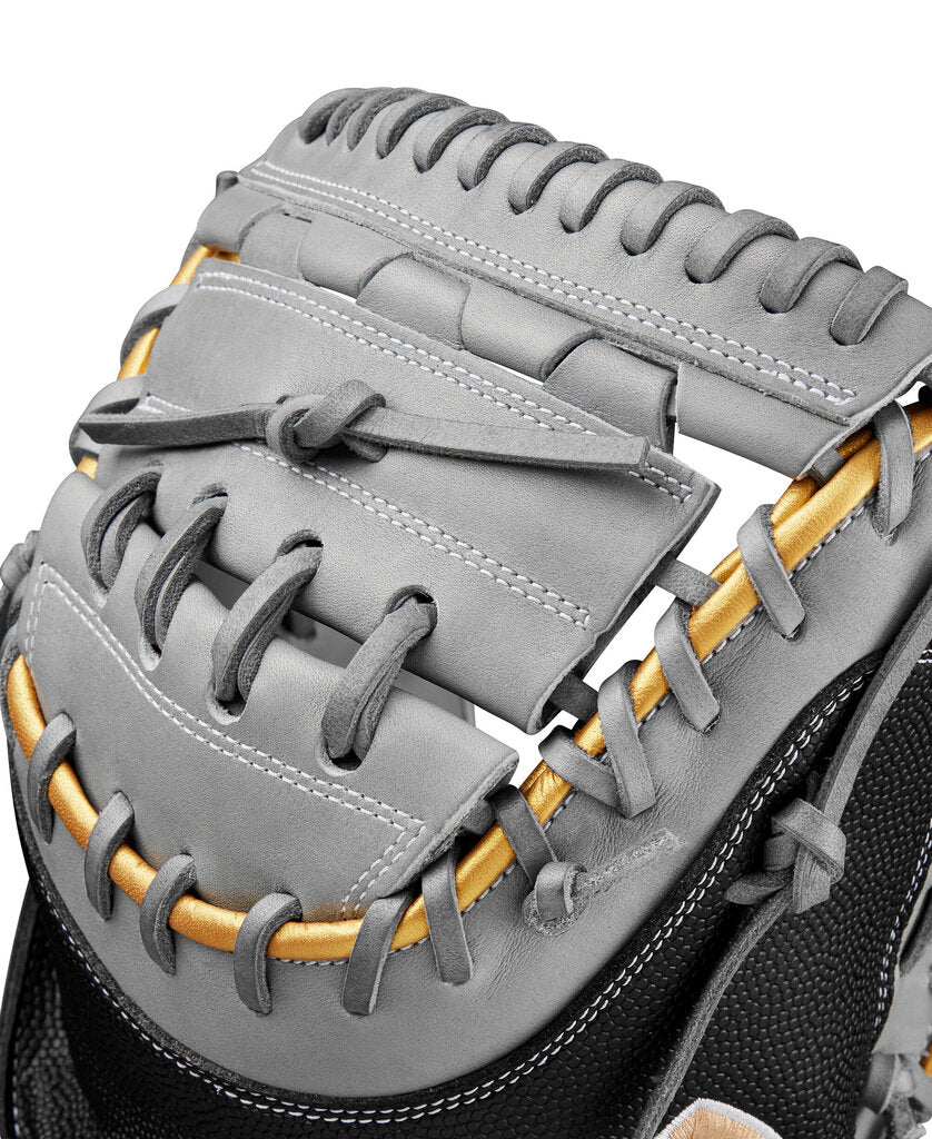 Fastpitch catcher mitt top view, grey web and lacing over black wrist area