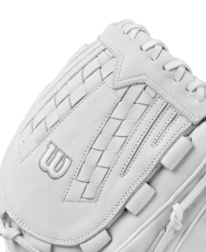 White fastpitch softball glove close-up of thumb area with Wilson “W” logo