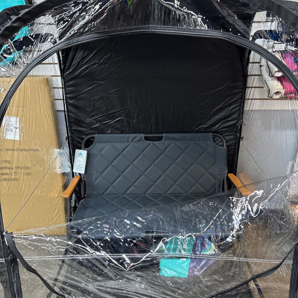 Folding portable bench inside an enclosure, quilted dark back and arm supports
