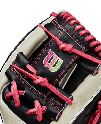 Wilson A2K baseball glove close-up, black web with Wilson logo, pink laces.