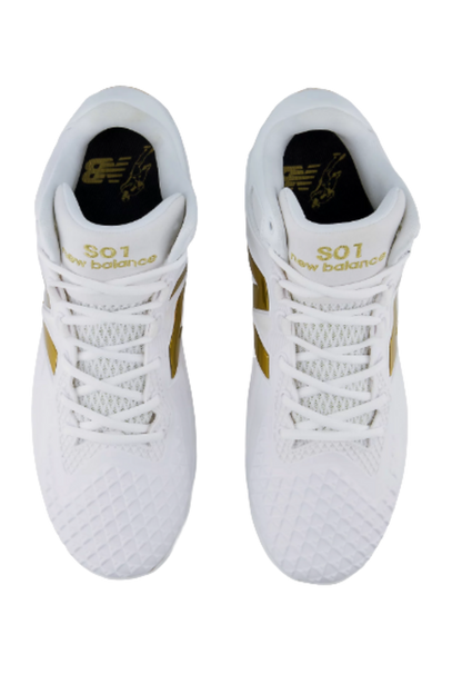 Pair of white baseball cleats with white laces and gold heel branding