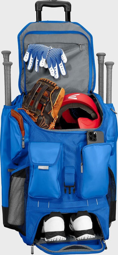 Blue wheeled bat bag with open compartments and padded front pockets, upright on wheels