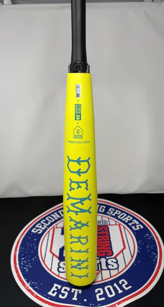 Yellow baseball bat handle area with blue label and teal graphics on barrel, upright