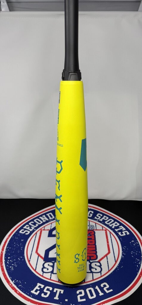 Yellow baseball bat standing upright with black handle; barrel graphics and grip end visible