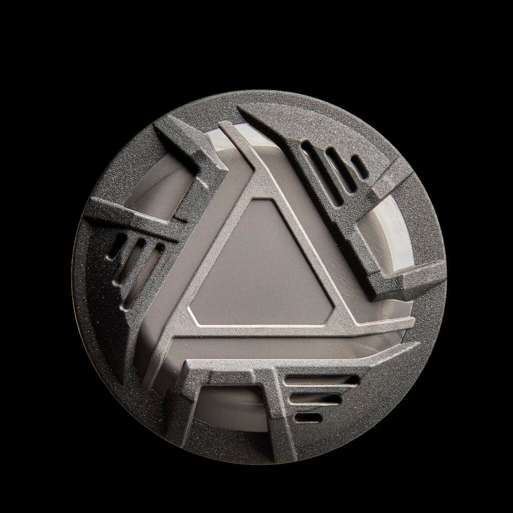 Baseball bat end cap detail with geometric pattern and vent-like cutouts