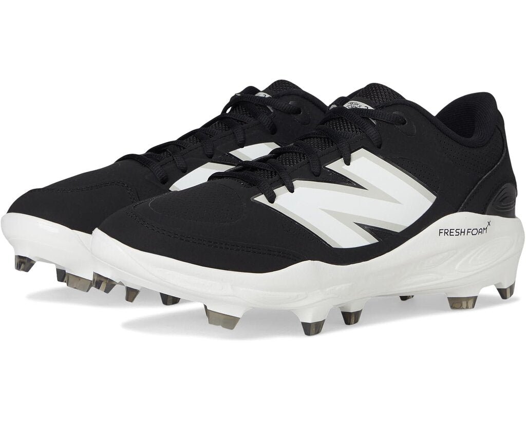 Black New Balance molded baseball cleats with lace-up front and metal studs