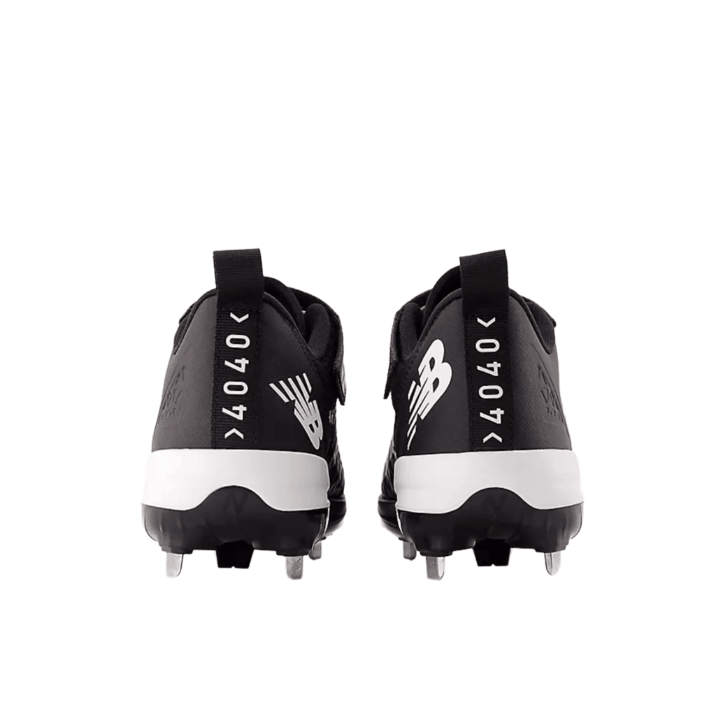 New Balance FuelCell baseball cleats, black with white heel stripe and rear logo