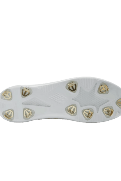 White cleat outsole with gold metal studs and traction pattern