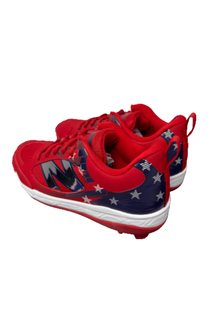 Youth molded cleats, red upper with navy star panel and white sole