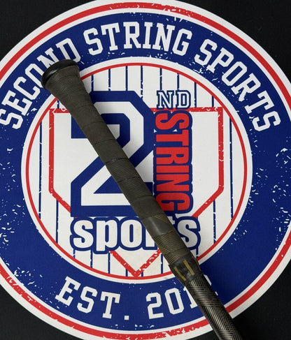 Used baseball bat end view with black handle grip and dark olive barrel