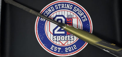 Used baseball bat with dark olive barrel and black grip, side view