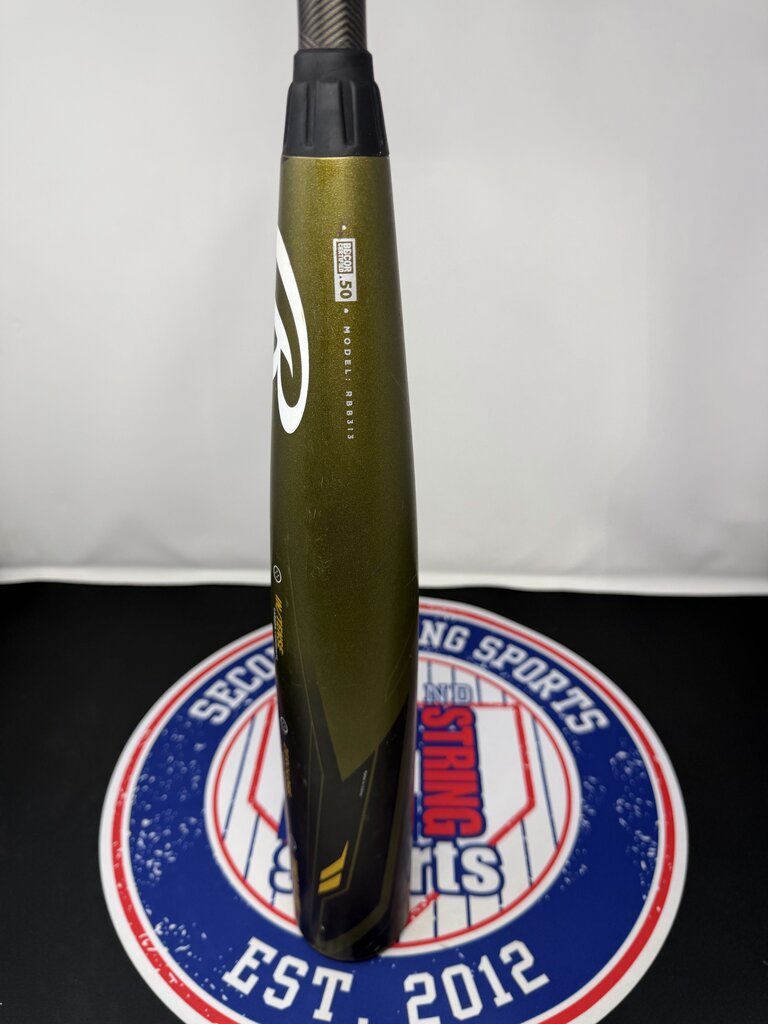 Used 32-inch baseball bat standing upright with dark olive barrel and black grip