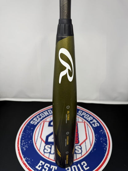 Used baseball bat with black grip and white R icon on olive barrel
