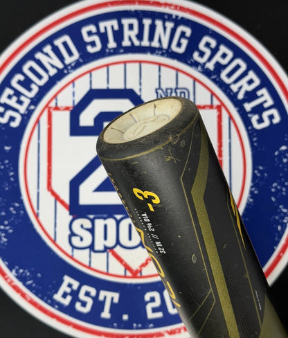 Used baseball bat showing end cap and black grip on a dark olive barrel