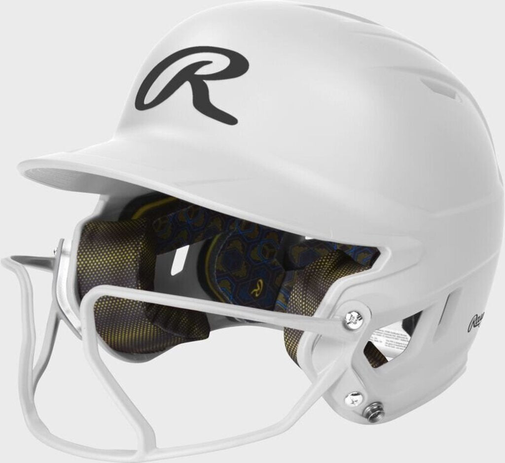 Rawlings white fastpitch batting helmet with face guard and patterned interior padding
