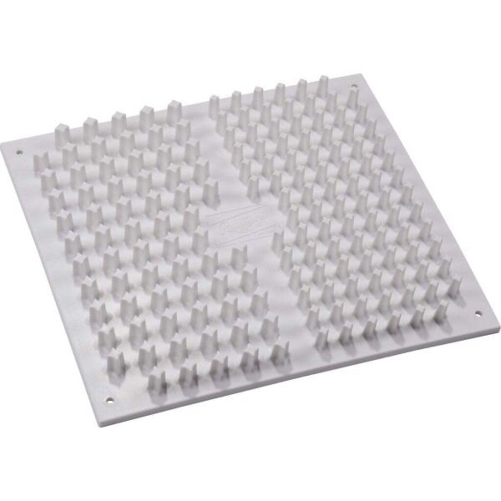 Shoe cleat cleaner board with raised rubber nubs on white base