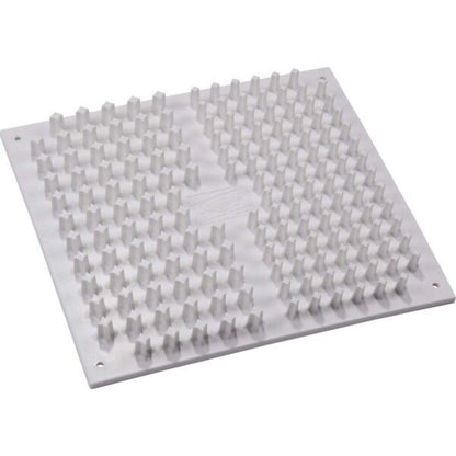 Shoe cleat cleaner board with raised rubber nubs on white base