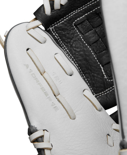 Fastpitch softball glove close-up, white palm panels with black leather and stitched laces