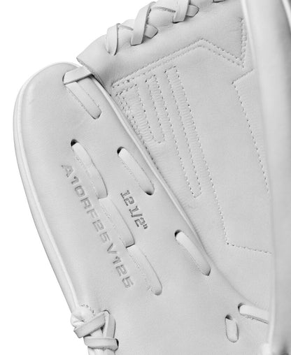 White fastpitch softball glove close-up of wrist panel and stitched logo accents