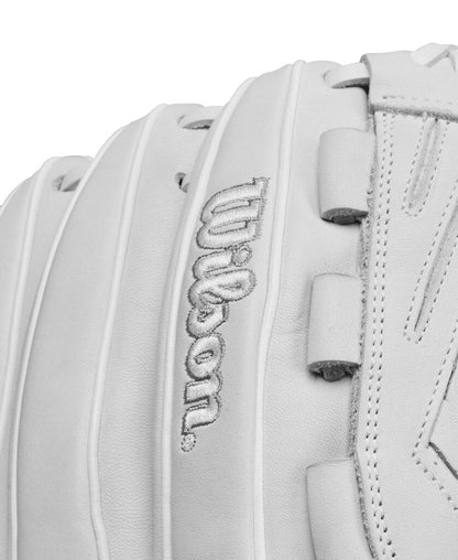 White fastpitch glove close-up of raised Wilson script on back panel