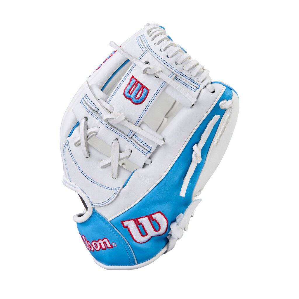 Fastpitch softball glove in white with blue and red accents, web and lacing detail