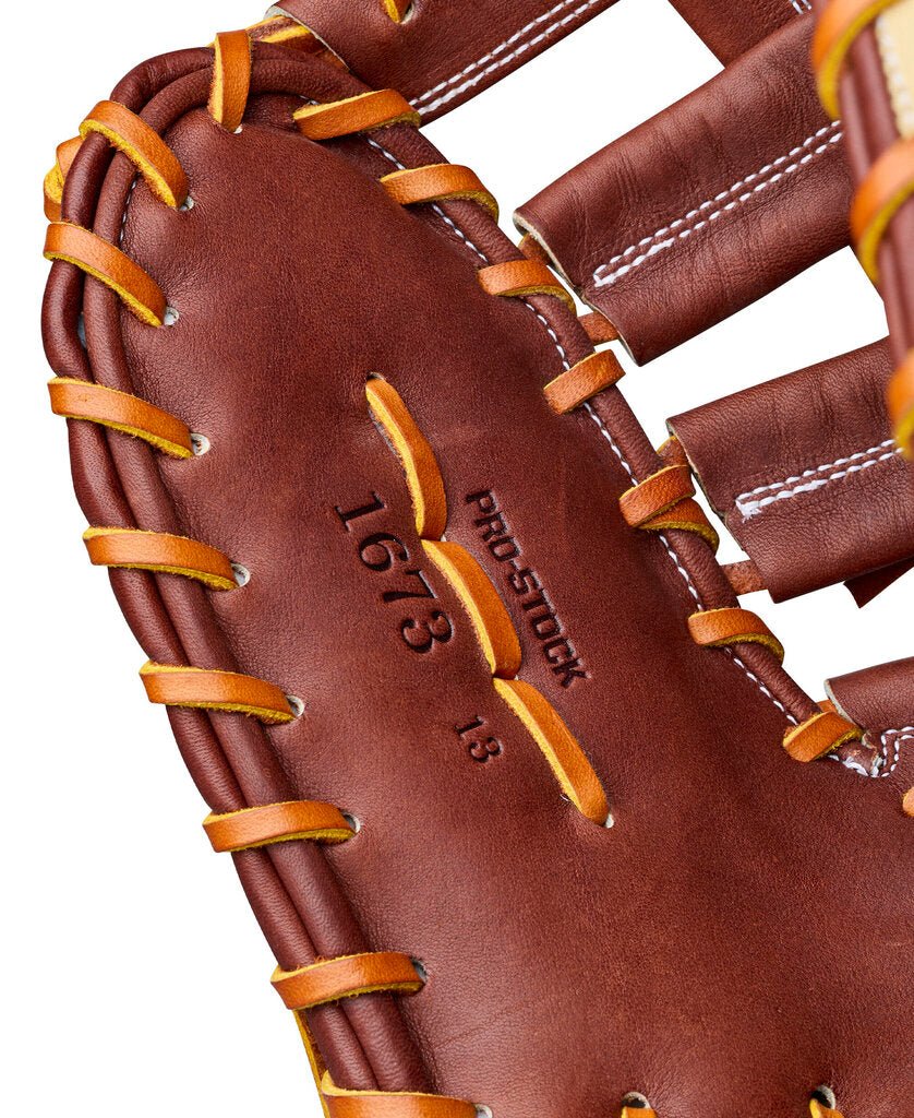 Baseball first base mitt close-up, embossed Pro Stock 19 logo on dark brown leather