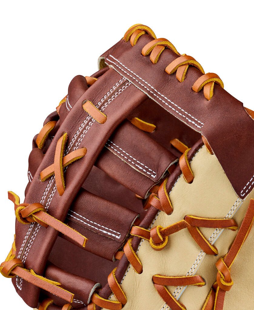 Baseball first base mitt close-up, dark brown leather with tan inserts and yellow laces