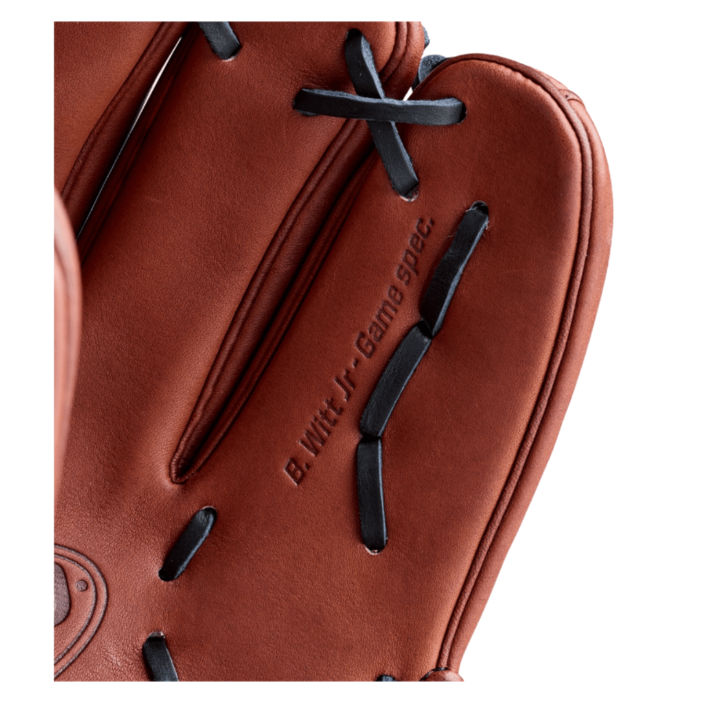 Close-up reddish-brown glove with embossed 'Game Used' text and black lace details