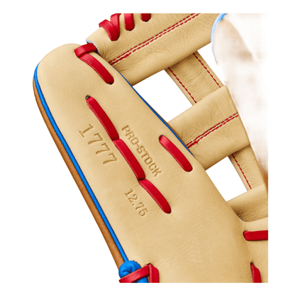 Tan glove close-up of 'Pro Stock' stamp and 'A2000' stitching, red laces