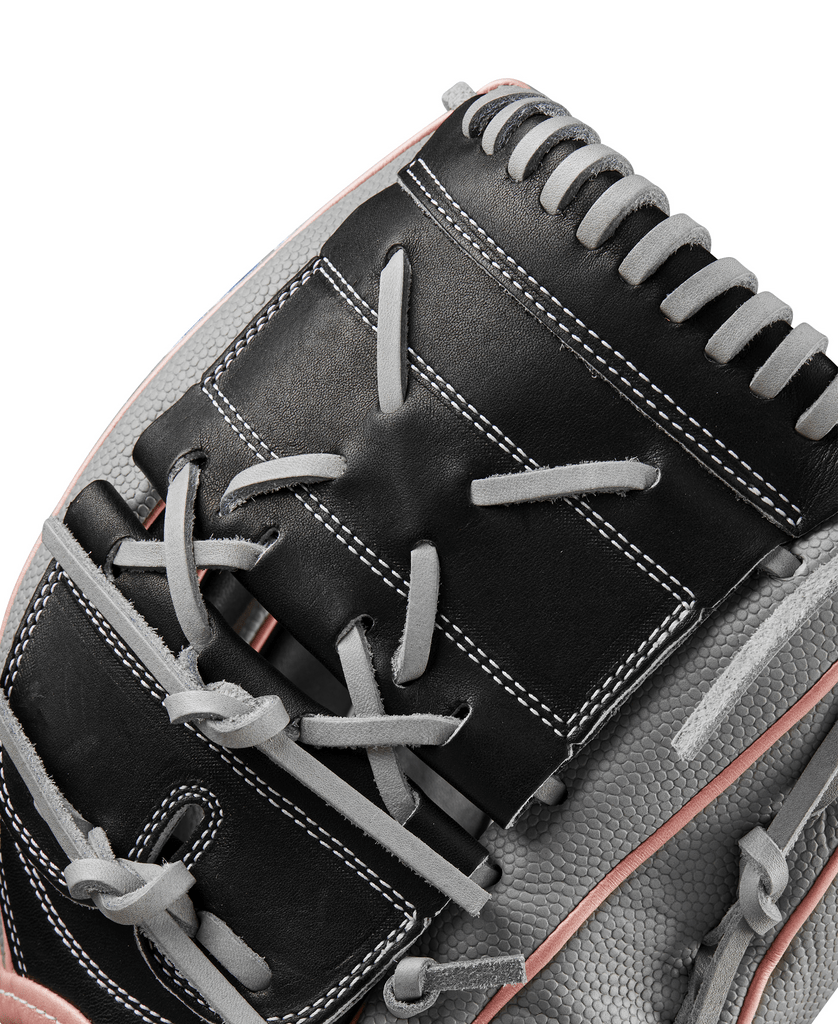 Fastpitch softball glove top view with black web, grey laces, and pink piping