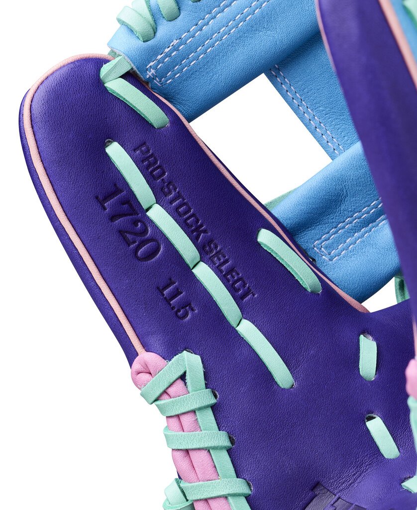 Close-up of purple glove leather with green laces and engraved 1720 text panel