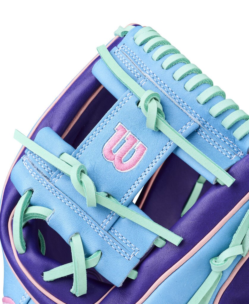 Close-up of sky blue glove palm with Wilson-style logo and teal lace webbing