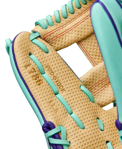 Baseball glove web close-up in blonde with seafoam lacing and purple border