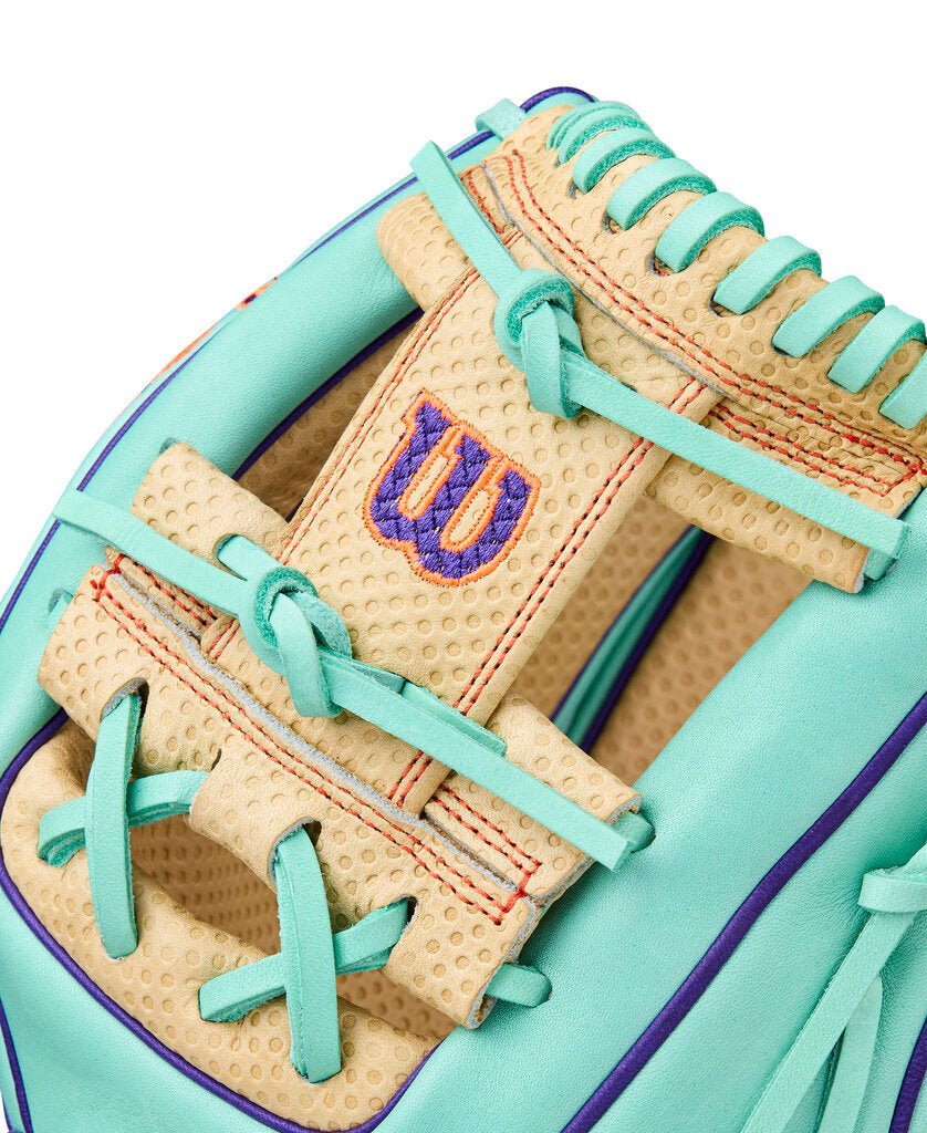 Baseball glove palm close-up with blonde texture, seafoam laces, W patch